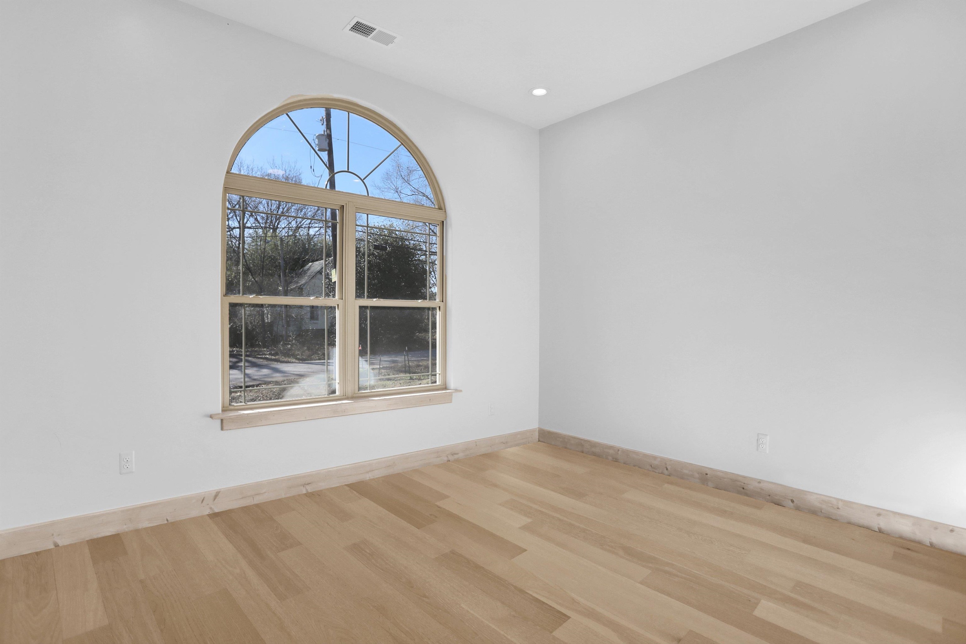 3 East Cherry Street Stanton, TN 38069 - Photo 14 of 33 an empty room with a fireplace and a window