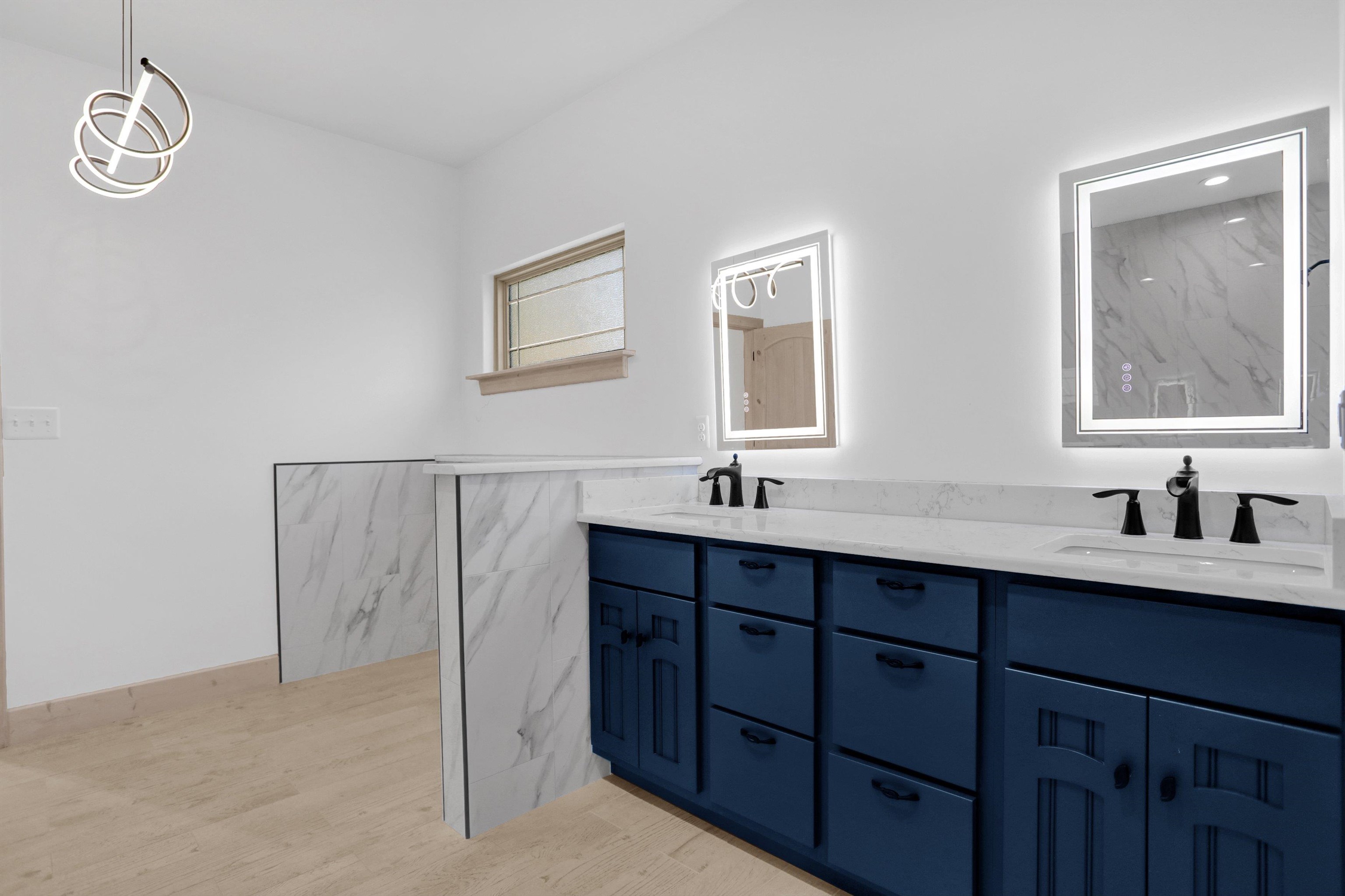 3 East Cherry Street Stanton, TN 38069 - Photo 18 of 33 a bathroom with a double vanity sink a mirror and a