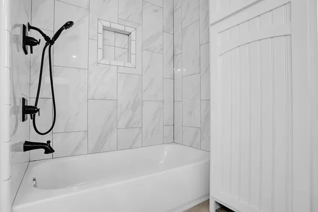 a bathroom with a toilet sink and a mirror