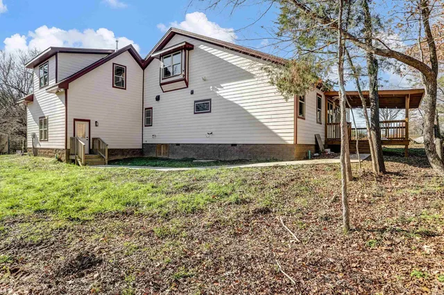 a view of front of house with a yard