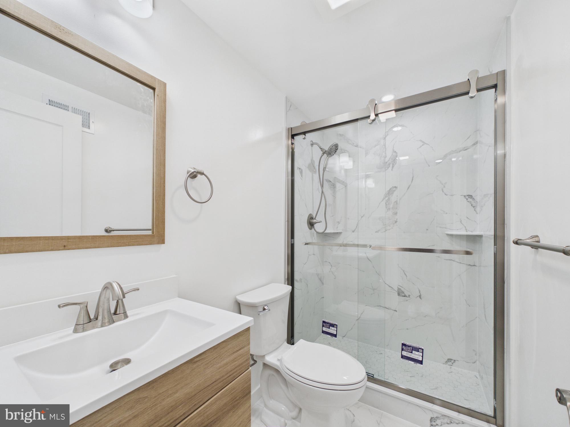 3629 Warren Street Philadelphia, PA 19104 - Photo 12 of 17 a bathroom with a sink toilet and shower