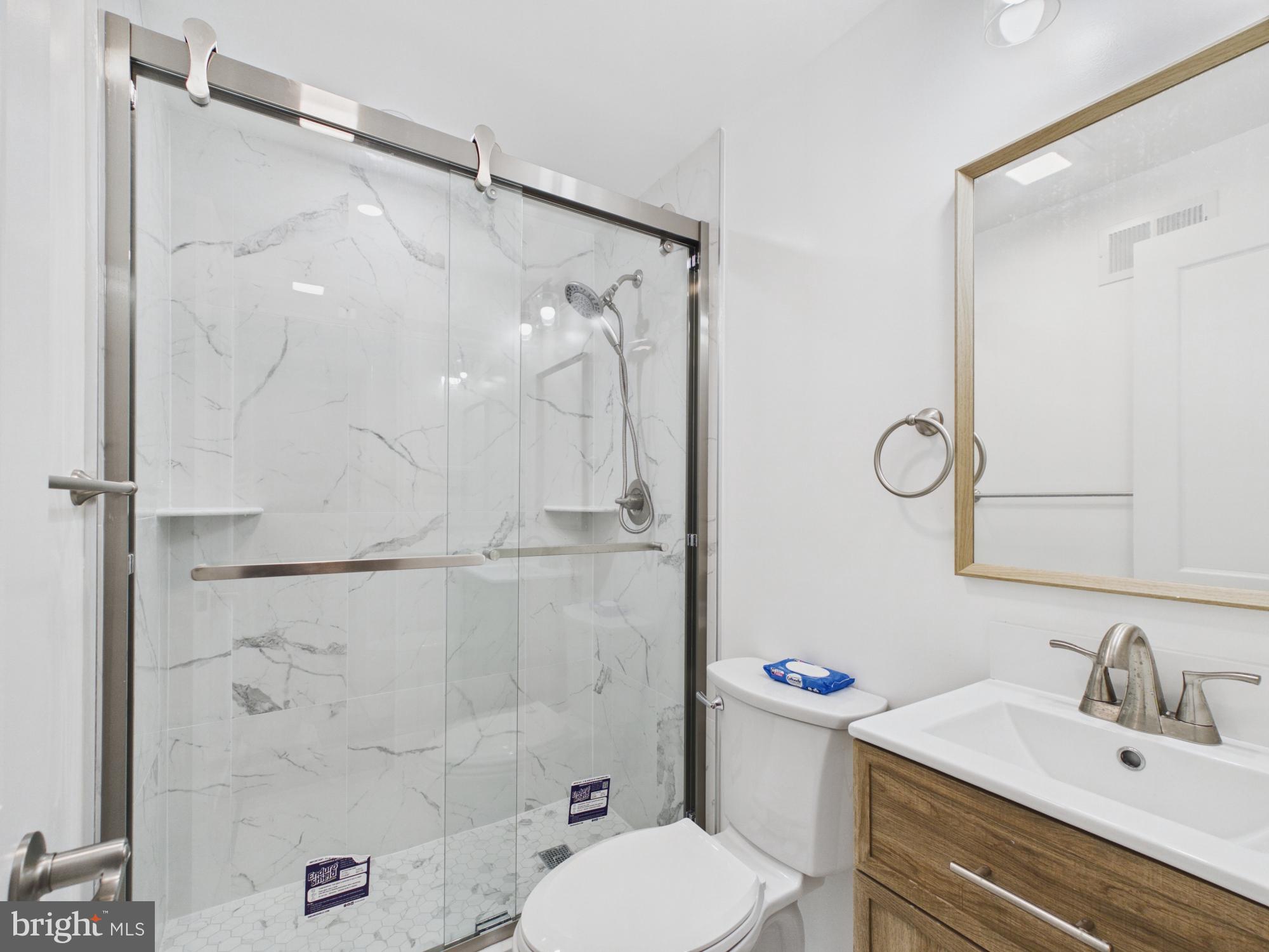 3629 Warren Street Philadelphia, PA 19104 - Photo 14 of 17 a bathroom with a sink toilet and shower
