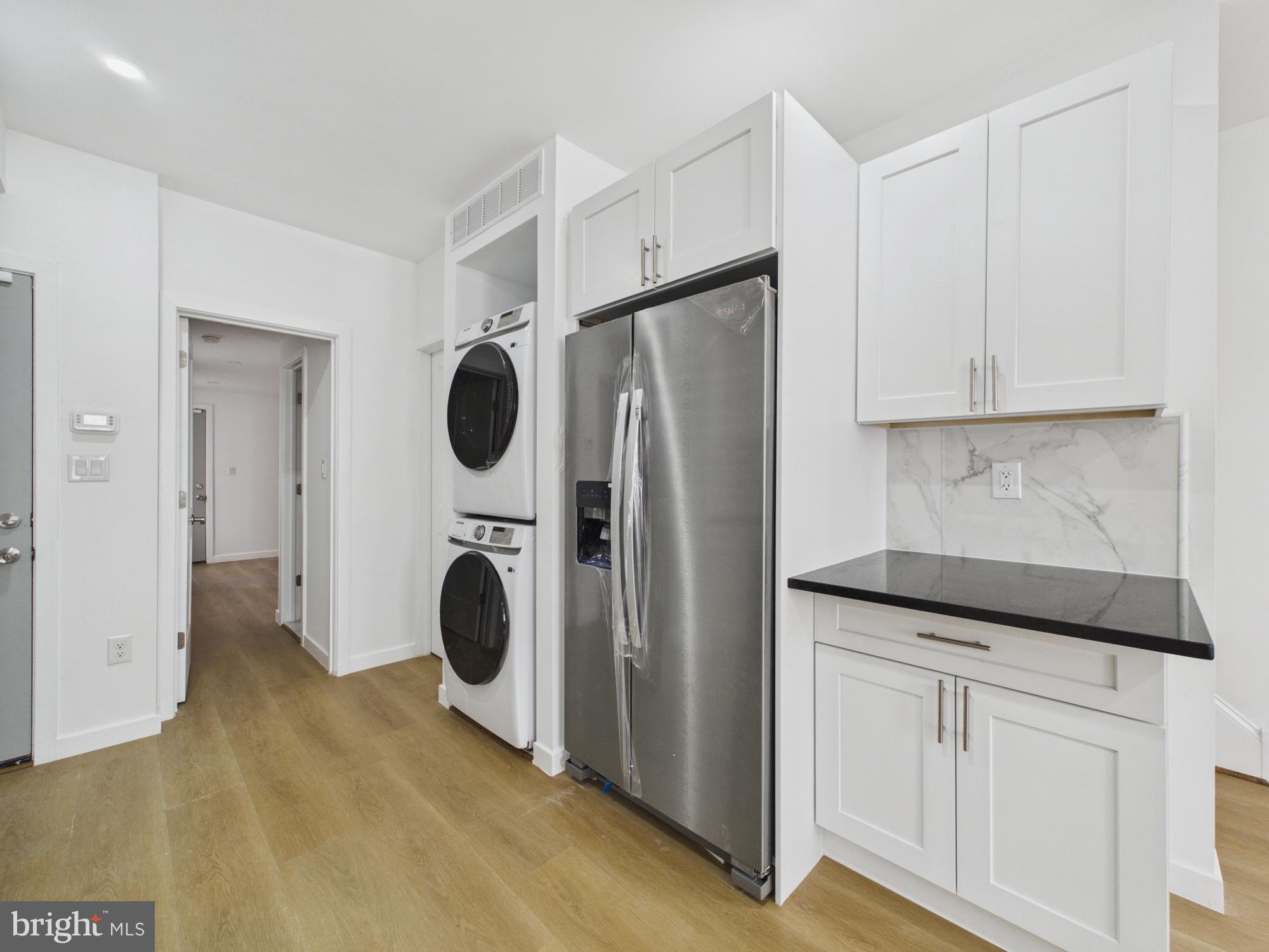3629 Warren Street Philadelphia, PA 19104 - Photo 3 of 17 a kitchen with a refrigerator and cabinets