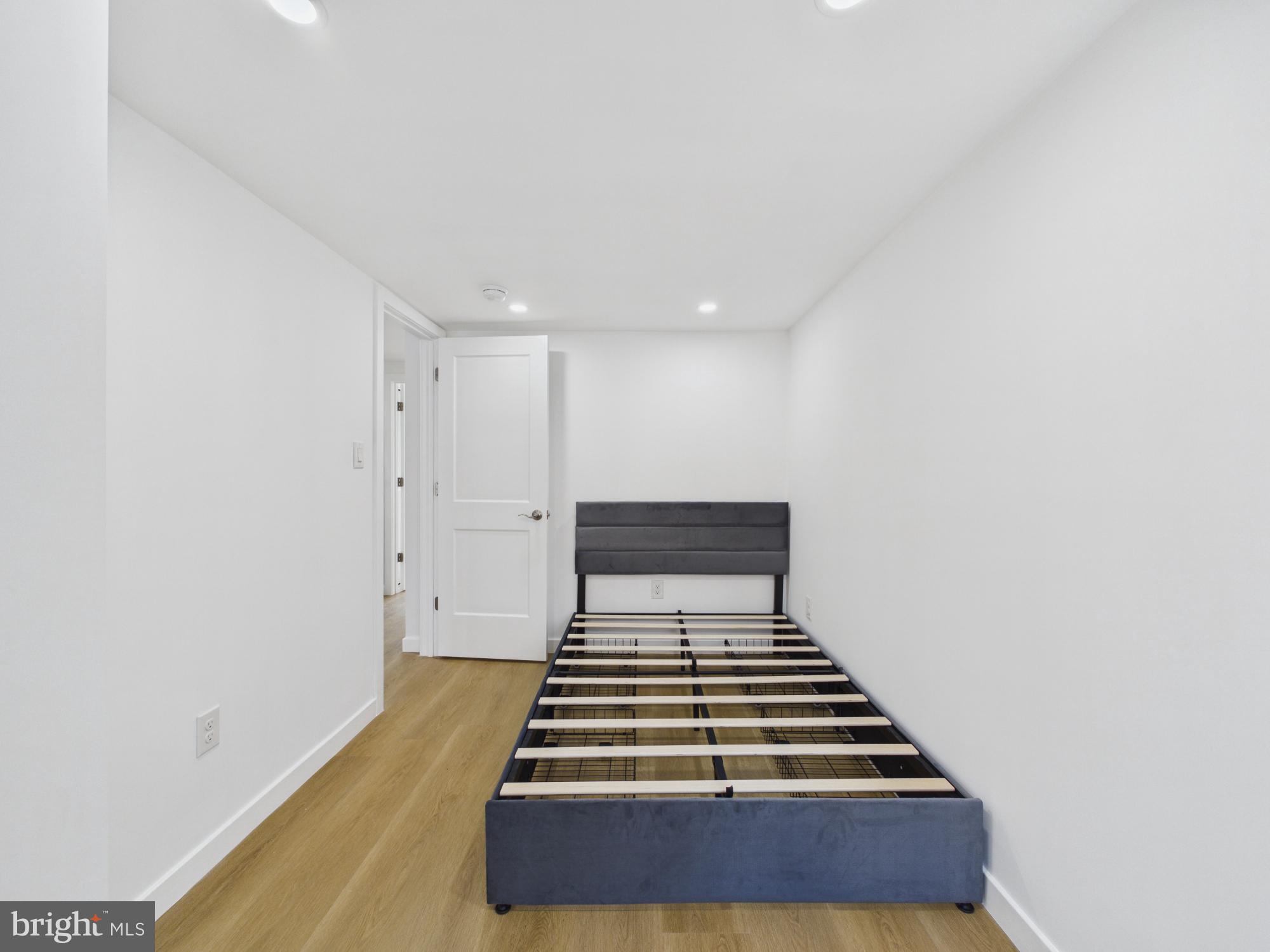 3629 Warren Street Philadelphia, PA 19104 - Photo 7 of 17 a view of a room with wooden floor and white walls
