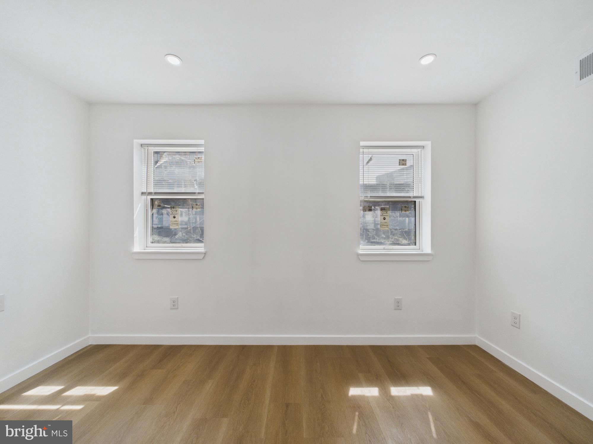 3629 Warren Street Philadelphia, PA 19104 - Photo 8 of 17 a view of an empty room with a window and wooden floor