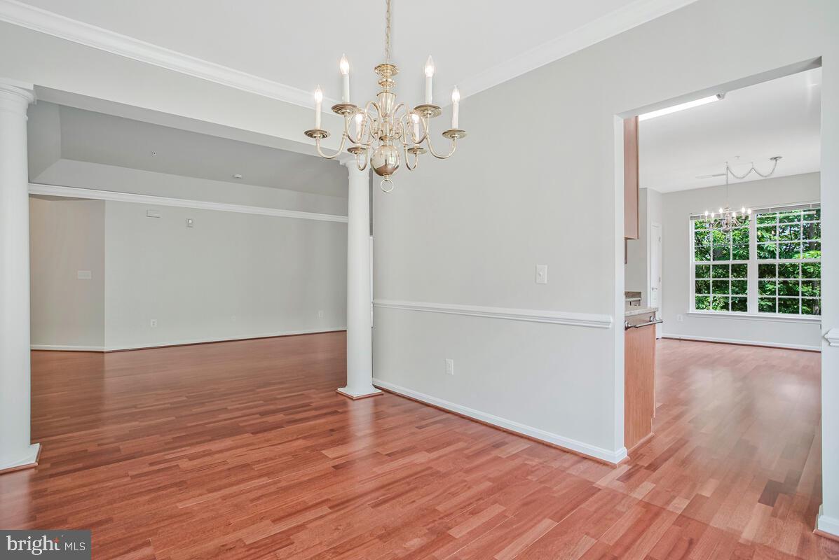 7305 Maplecrest Road, Unit 206 Elkridge, MD 21075 - Photo 13 of 62 wooden floor in an empty room with a window