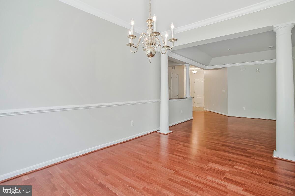 7305 Maplecrest Road, Unit 206 Elkridge, MD 21075 - Photo 14 of 62 a view of a hallway with wooden floor