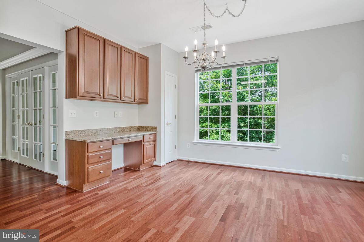 7305 Maplecrest Road, Unit 206 Elkridge, MD 21075 - Photo 20 of 62 a view of livingroom with kitchen and hardwood