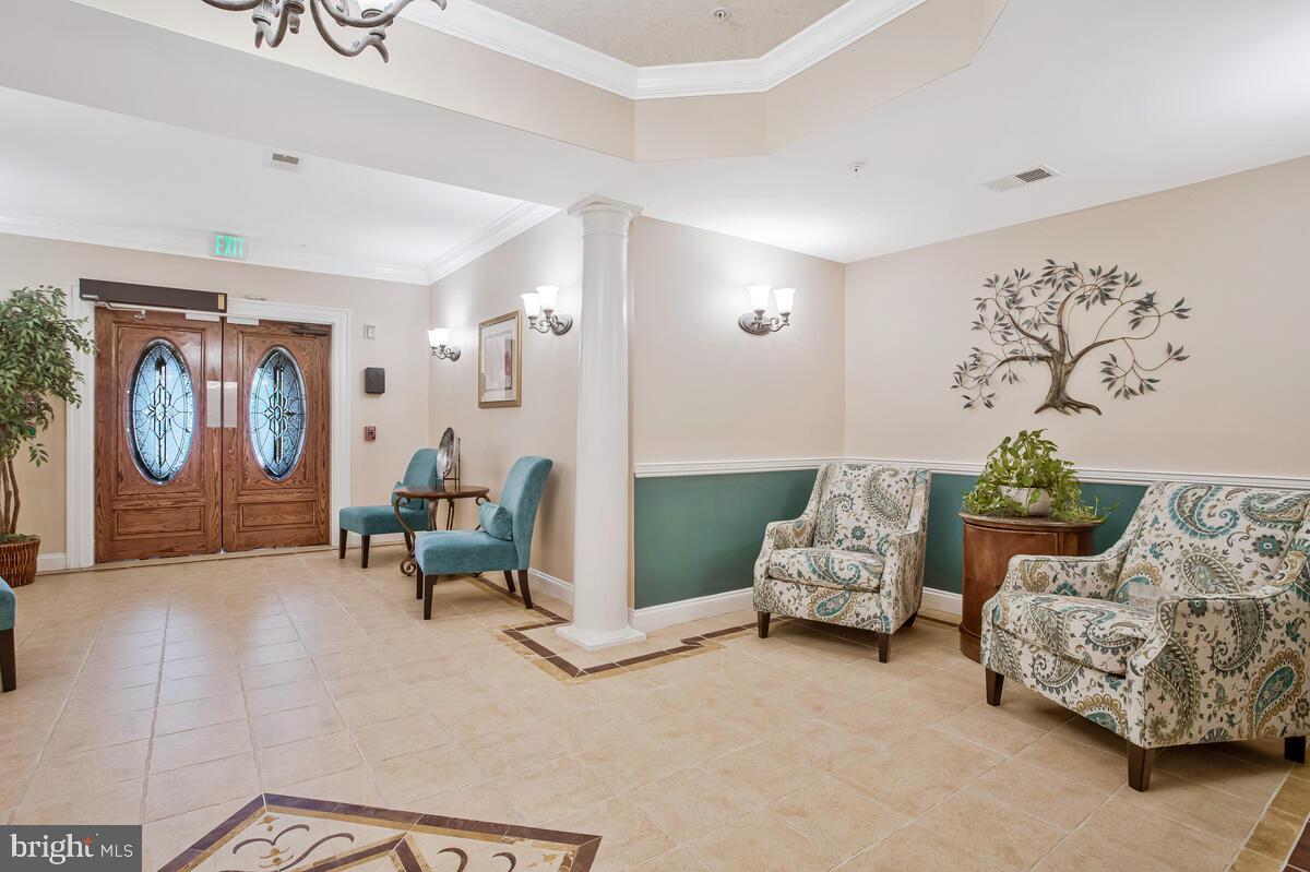 7305 Maplecrest Road, Unit 206 Elkridge, MD 21075 - Photo 35 of 62 a living room with furniture and a fireplace