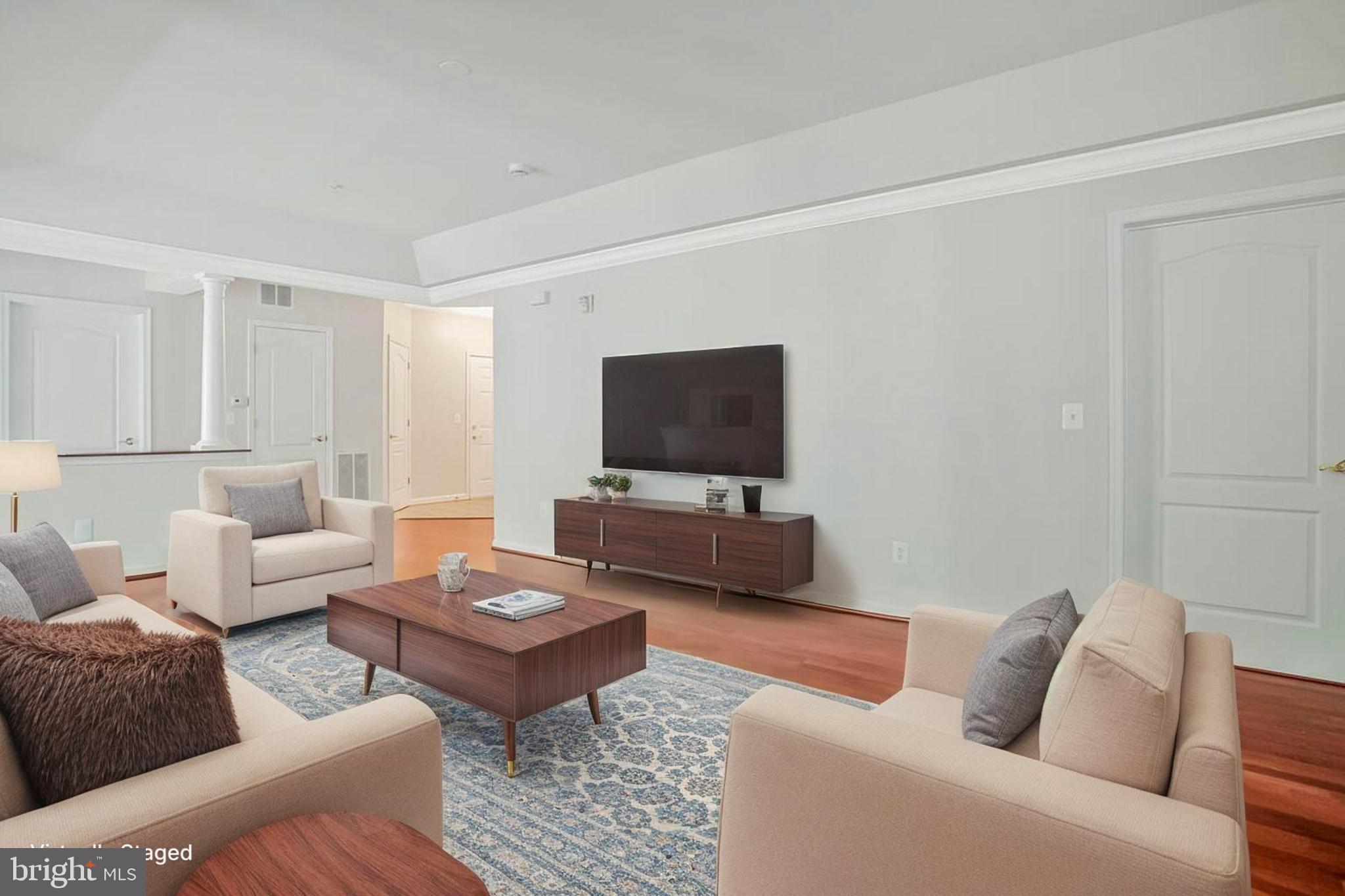 7305 Maplecrest Road, Unit 206 Elkridge, MD 21075 - Photo 6 of 62 a living room with furniture and a flat screen tv