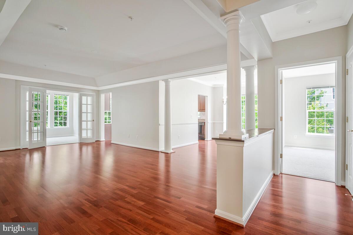 7305 Maplecrest Road, Unit 206 Elkridge, MD 21075 - Photo 8 of 62 a view of an empty room with wooden floor and a window