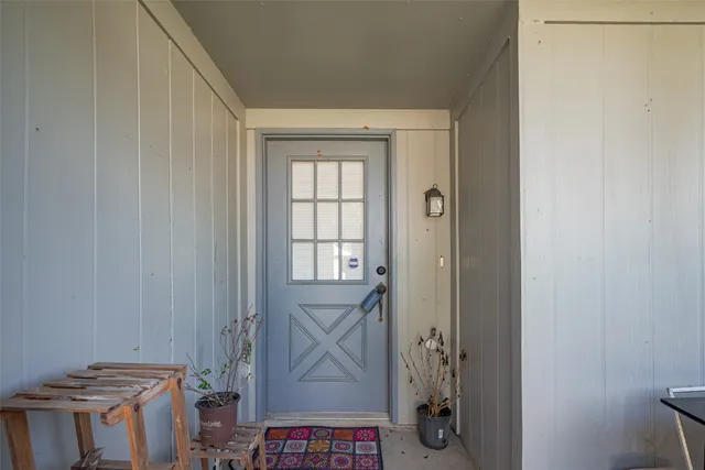a view of a hallway with front door