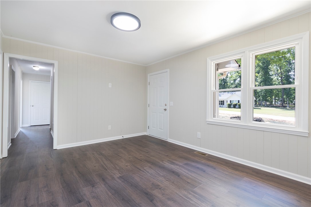 113 Linda Lane Honea Path, SC 29654 - Photo 8 of 36 This bright room features durable flooring and abundant natural light.