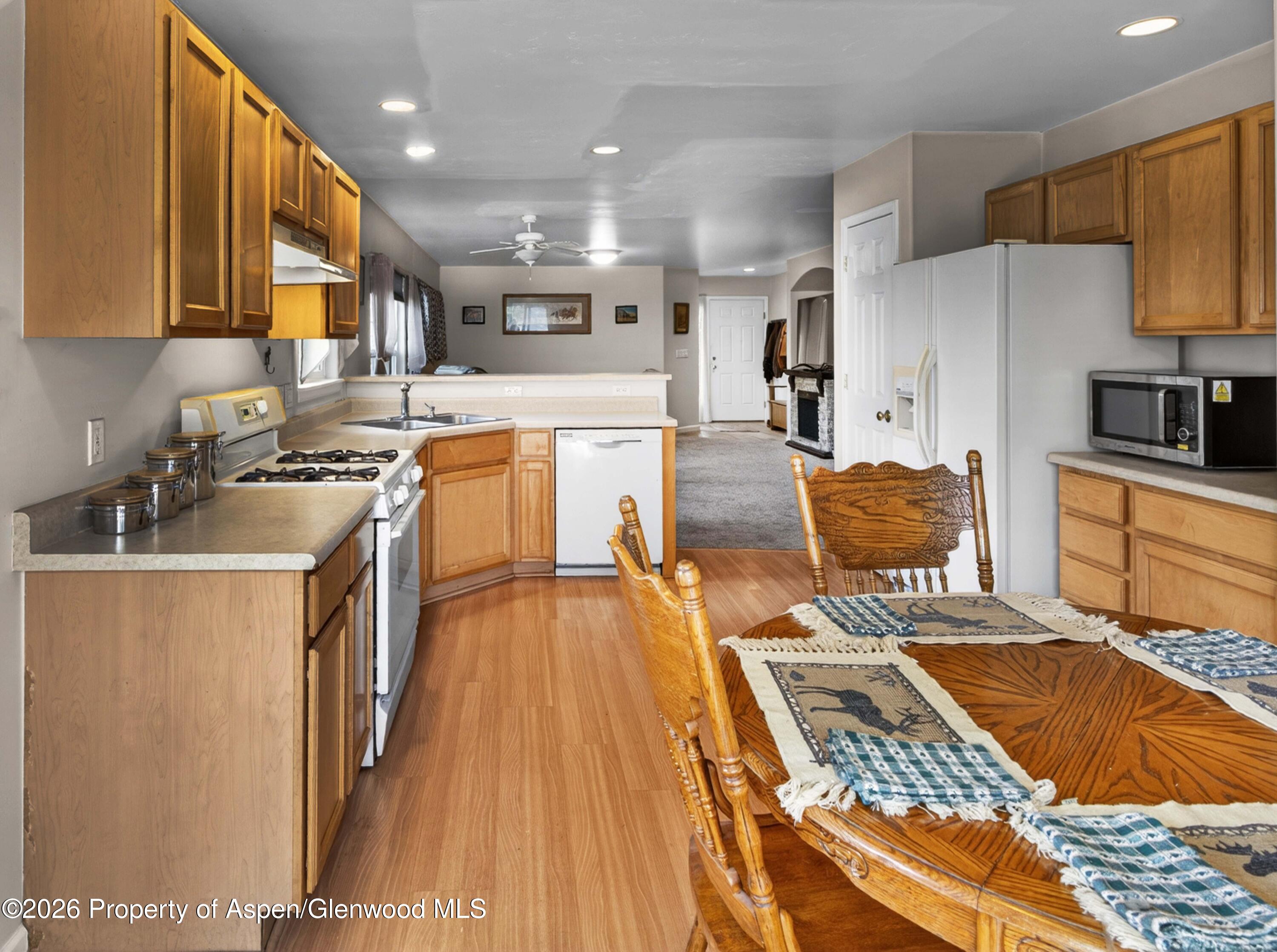 608 Lariat Loop New Castle, CO 81647 - Photo 10 of 32 a kitchen with a sink stove top oven and cabinets