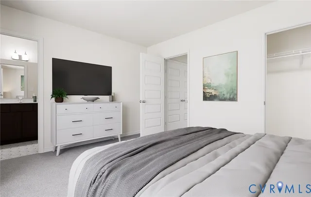 a bedroom with a bed and flat screen tv