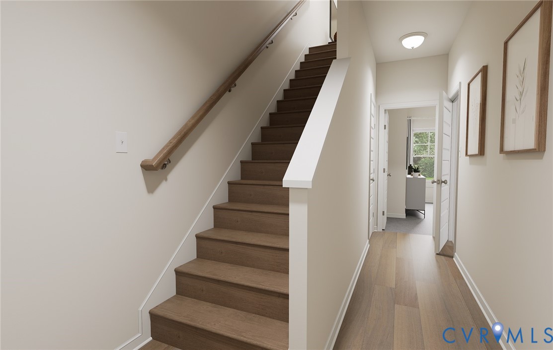285 Greenpark Road Sandston, VA 23150 - Photo 6 of 29 a view of staircase with lots of frames on wall and windows