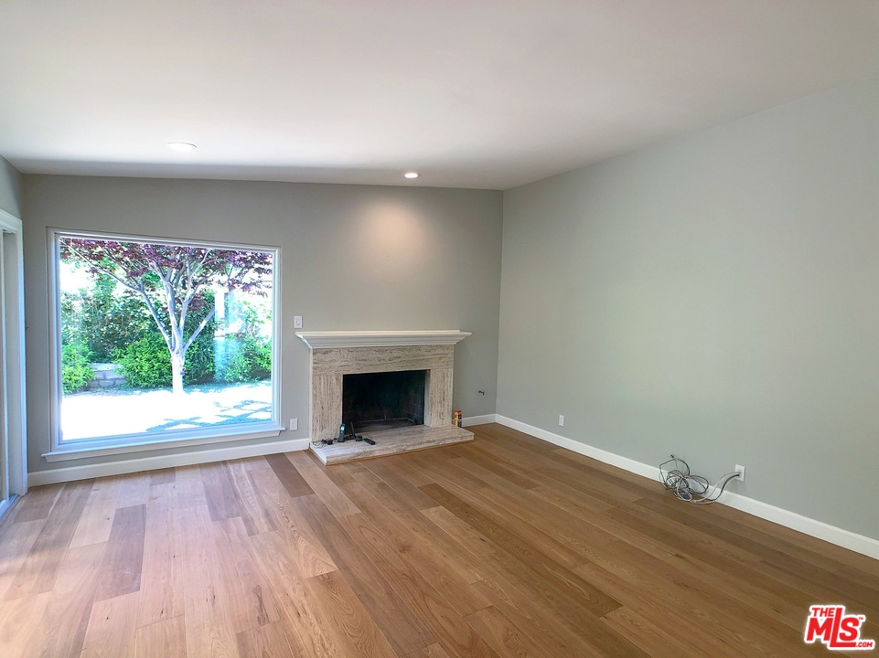 18325 Coastline Drive Malibu, CA 90265 - Photo 11 of 20 a view of empty room with wooden floor and fan