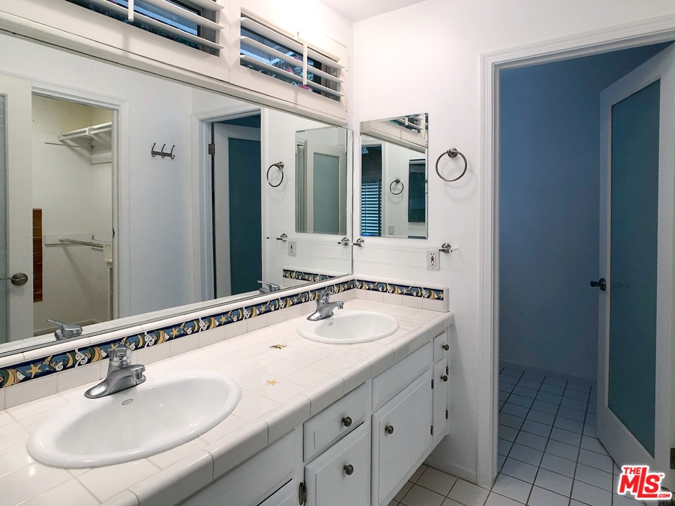 18325 Coastline Drive Malibu, CA 90265 - Photo 13 of 20 a bathroom with a sink and a mirror