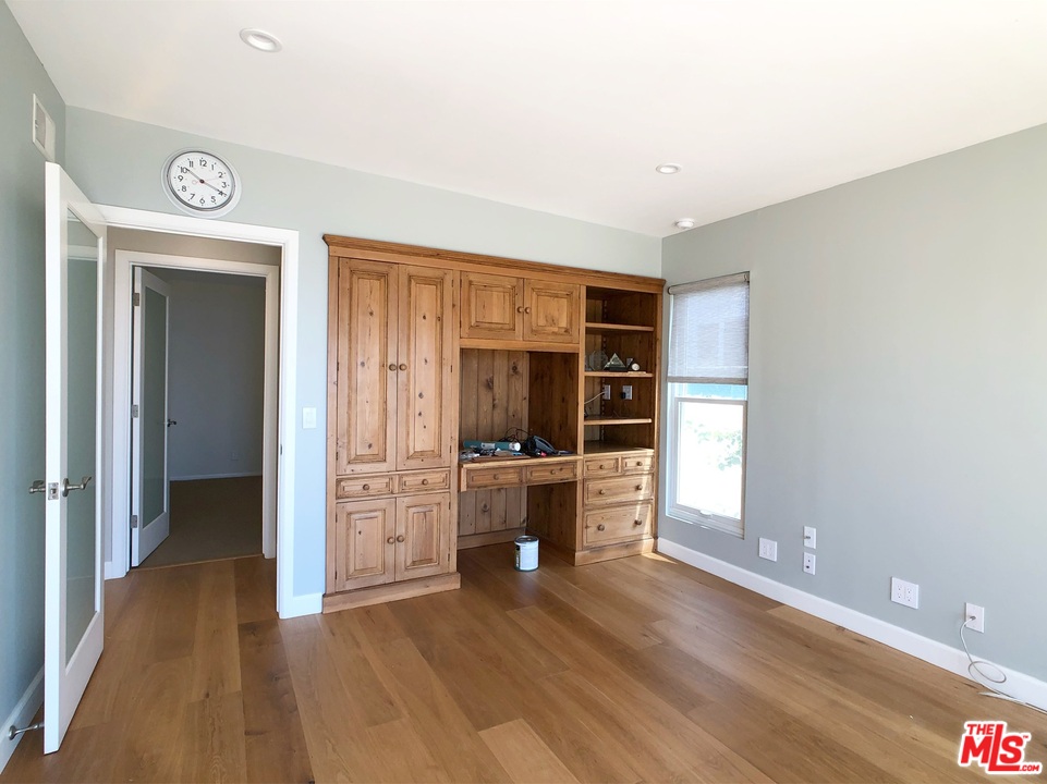 18325 Coastline Drive Malibu, CA 90265 - Photo 15 of 20 wooden floor in an empty room and a window