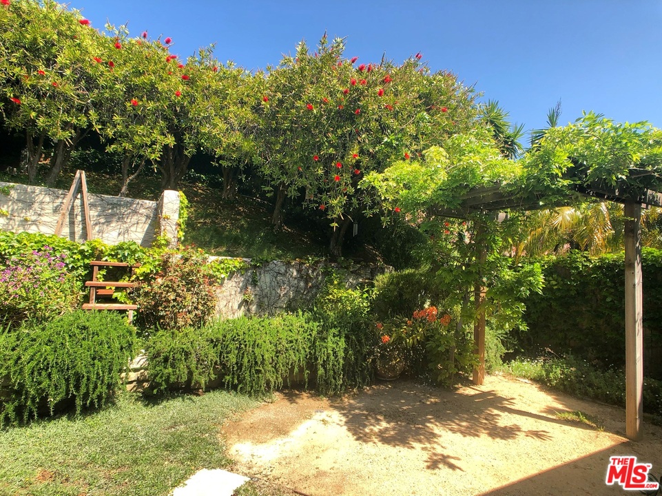 18325 Coastline Drive Malibu, CA 90265 - Photo 19 of 20 a backyard of a house with lots of green space