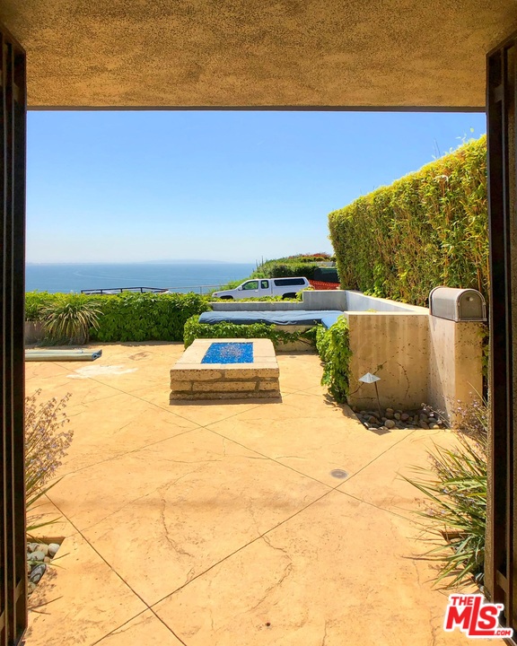 18325 Coastline Drive Malibu, CA 90265 - Photo 6 of 20 a view of swimming pool with seating area and green space