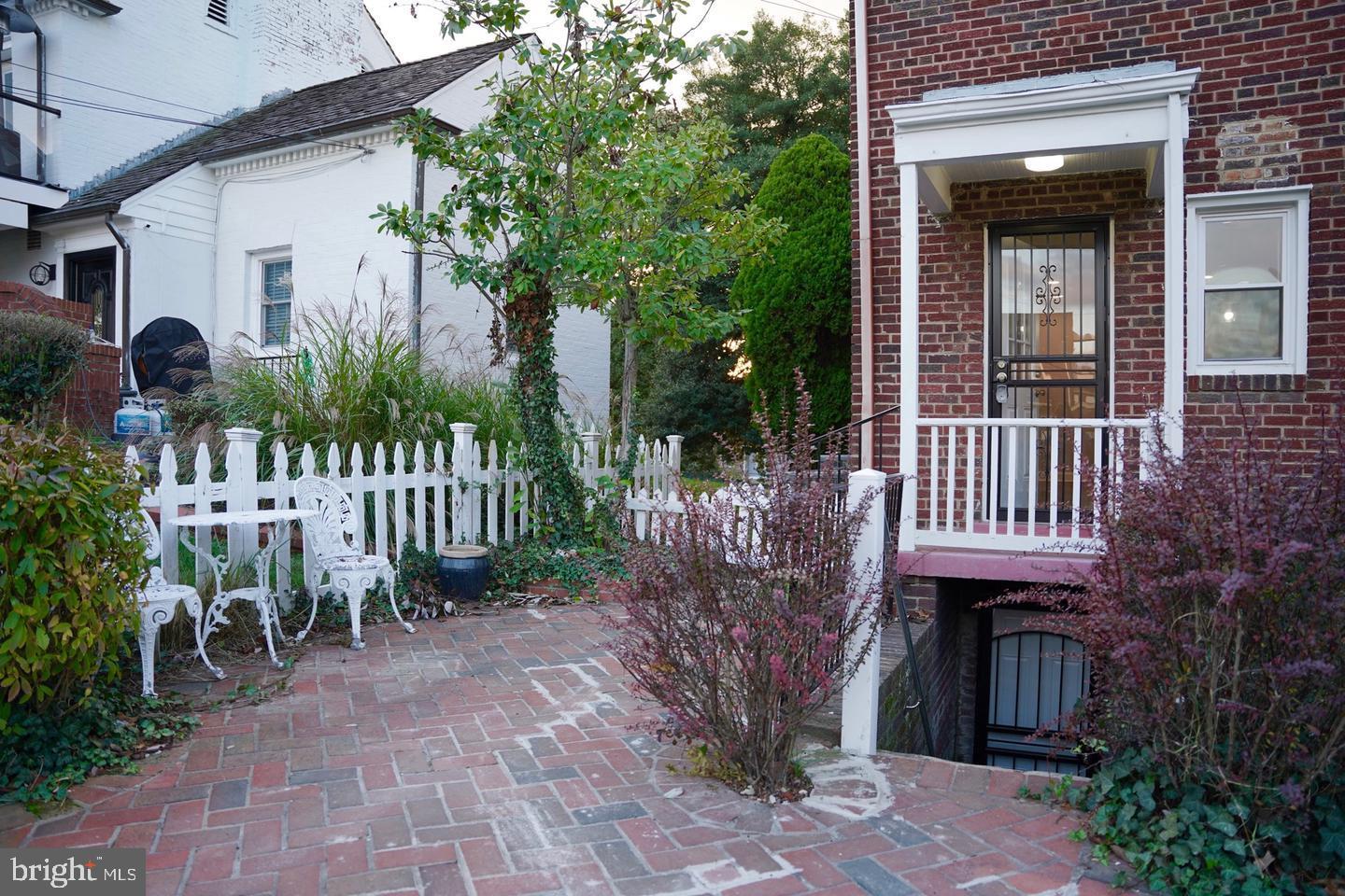 2112 Branch Avenue Southeast Washington, DC 20020 - Photo 12 of 14 a front view of a house with a yard