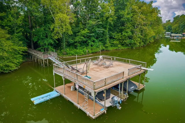 a kitchen with a stove and a wooden floor