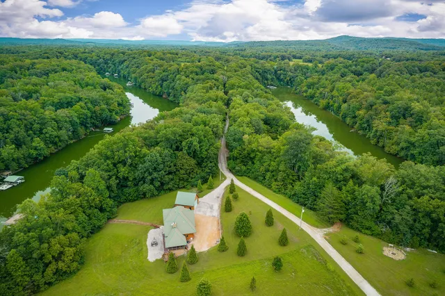 a kitchen with kitchen island a sink stove and refrigerator