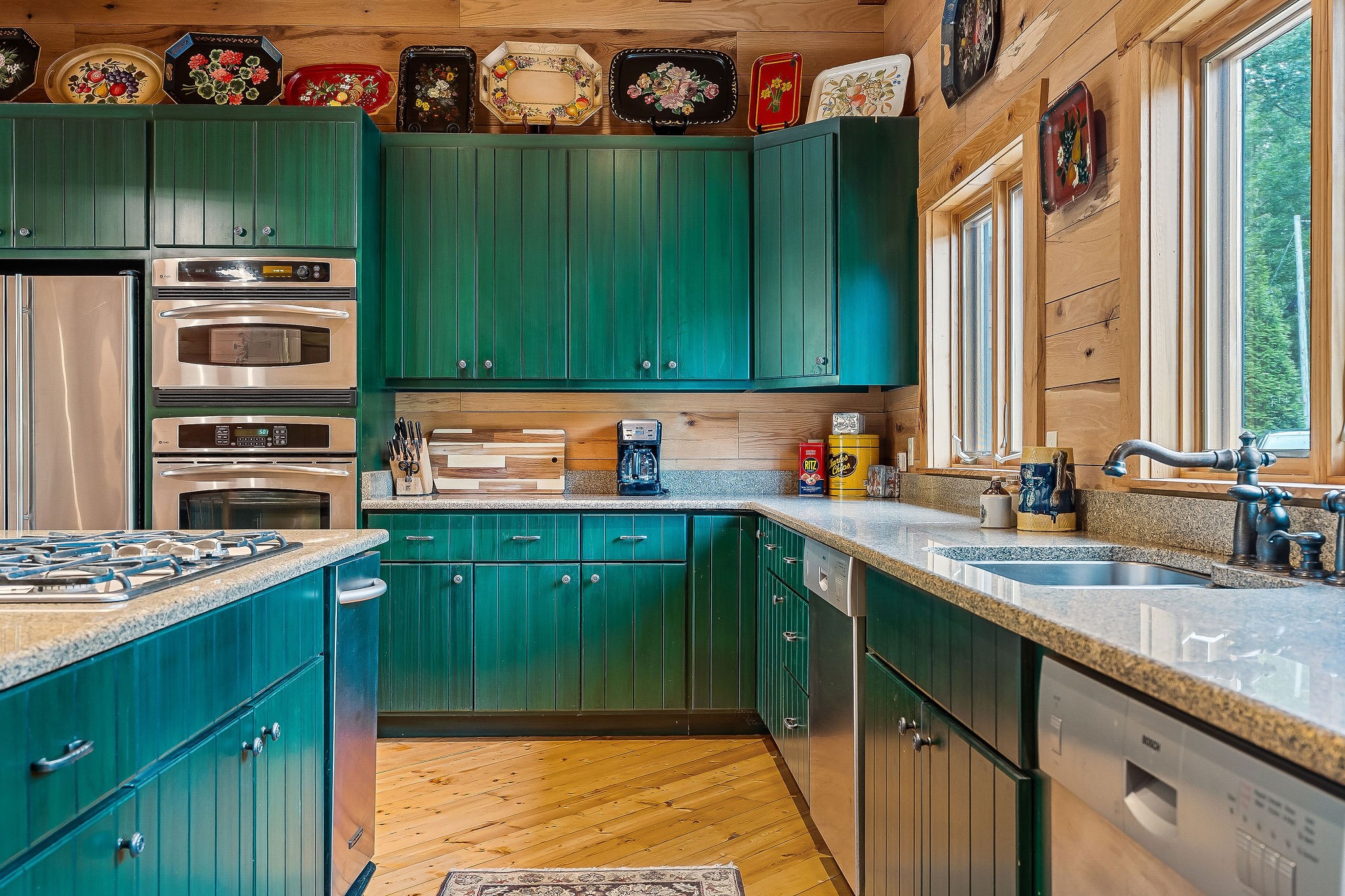 4042 Rocky Ridge Road Doyle, TN 38559 - Photo 31 of 85 a kitchen with stainless steel appliances granite countertop a sink stove and cabinets