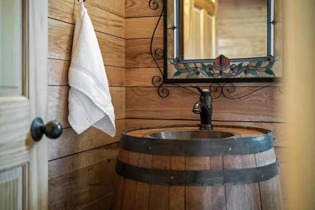 a view of a balcony with furniture and wooden floor
