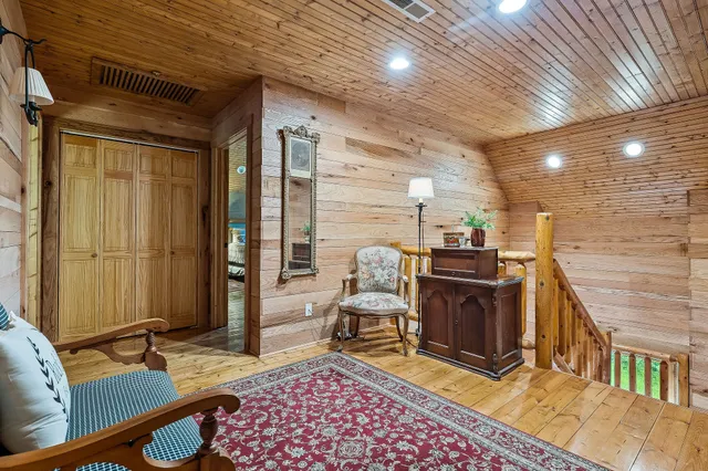 a bathroom with a sink a toilet a mirror and shower