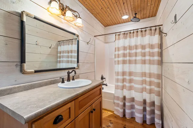 a view of a big yard with large trees