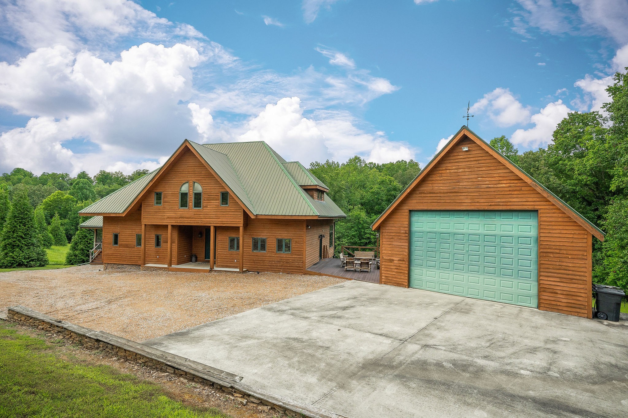 4042 Rocky Ridge Road Doyle, TN 38559 - Photo 6 of 85 a front view of a house with a yard and garage