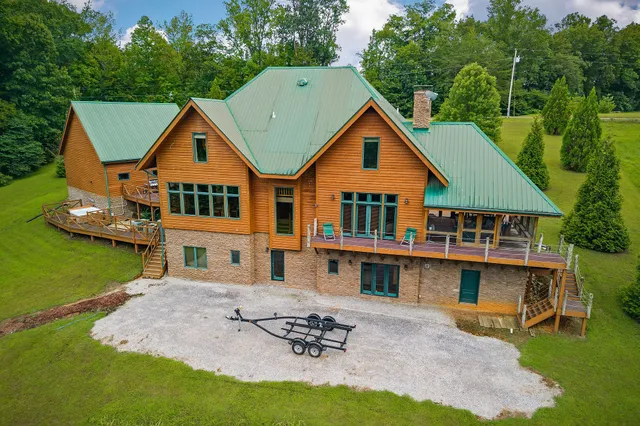 a view of a balcony with chairs and wooden floor