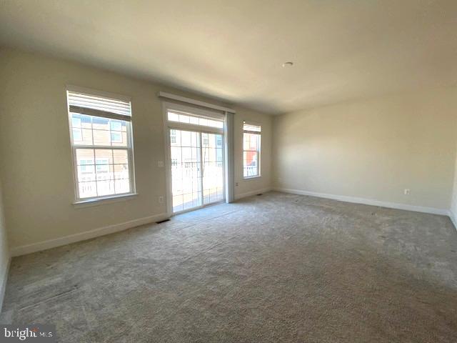 10726 Shadewell Spring Way Manassas, VA 20112 - Photo 12 of 29 an empty room with windows