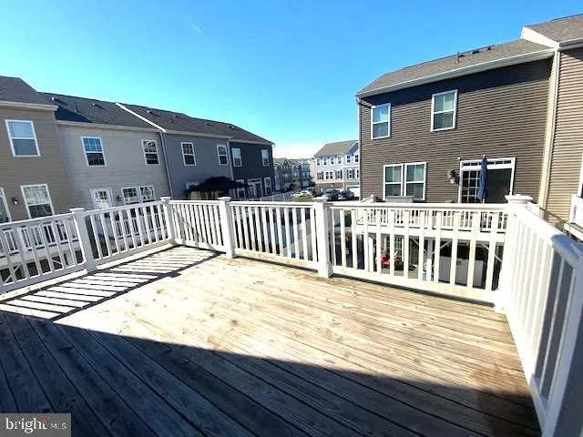 a view of a house with wooden deck