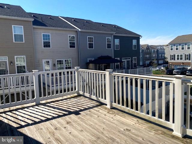 10726 Shadewell Spring Way Manassas, VA 20112 - Photo 17 of 29 a view of a wooden roof deck