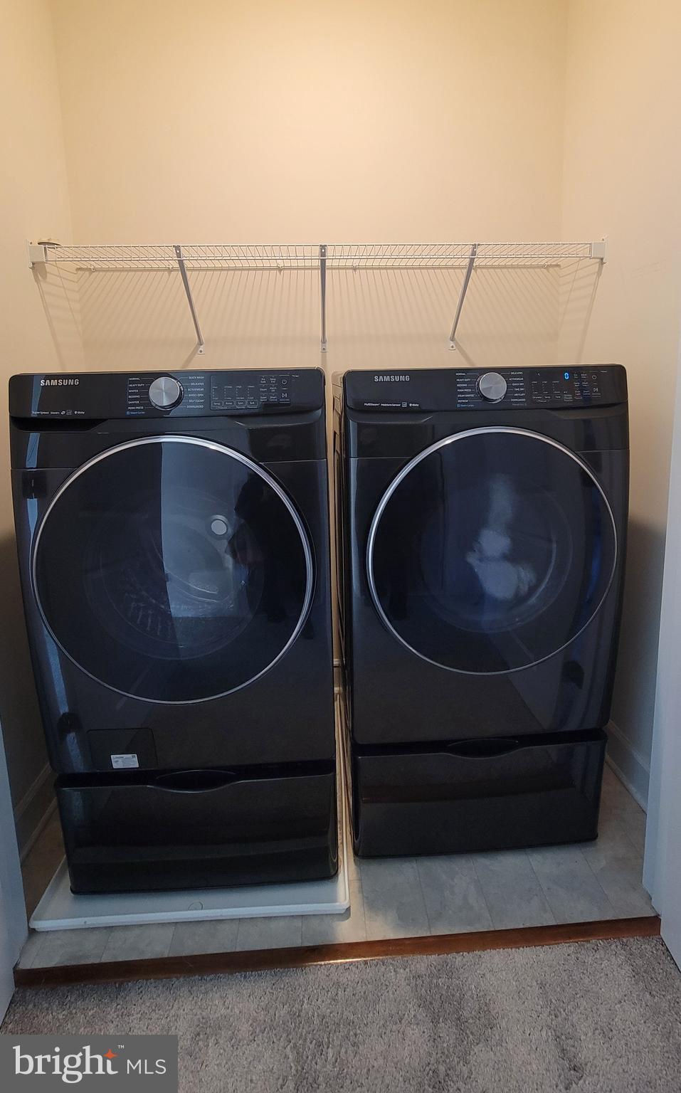 10726 Shadewell Spring Way Manassas, VA 20112 - Photo 20 of 29 a utility room with dryer and washer