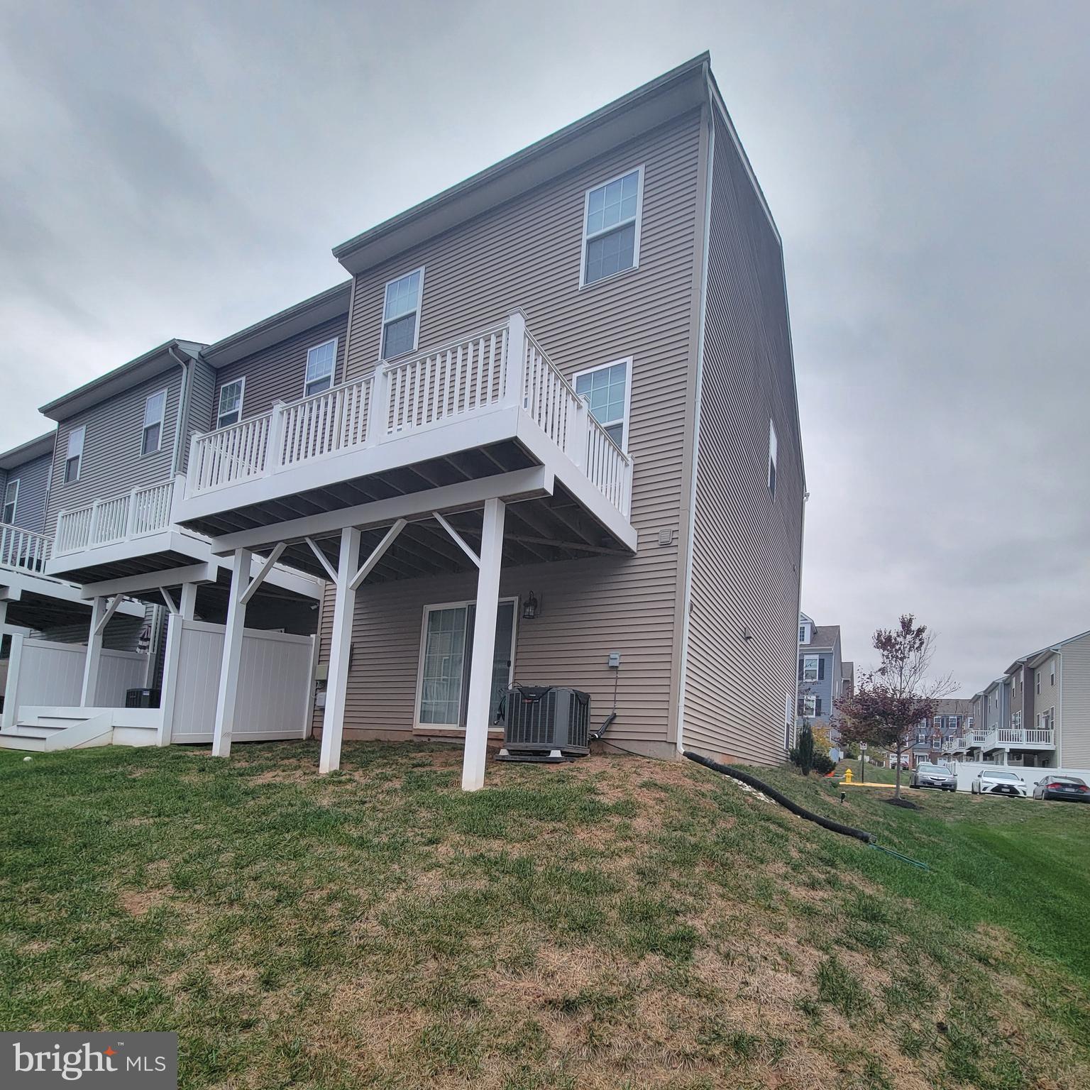 10726 Shadewell Spring Way Manassas, VA 20112 - Photo 29 of 29 a front view of a house with a yard