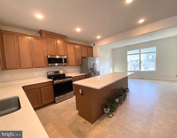 10726 Shadewell Spring Way Manassas, VA 20112 - Photo 9 of 29 a kitchen with a stove a sink and a microwave