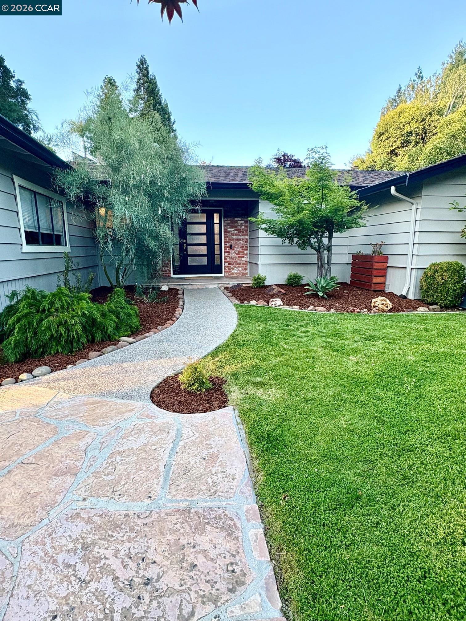 2589 Pebble Beach Loop Lafayette, CA 94549 - Photo 3 of 32 a house view with a garden space