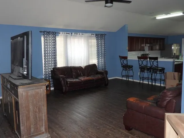 a living room with furniture and a window