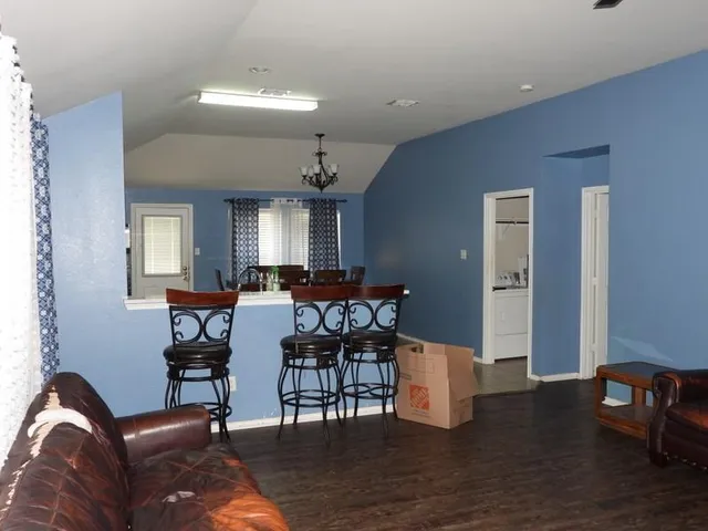 a view of a livingroom with furniture and wooden floor