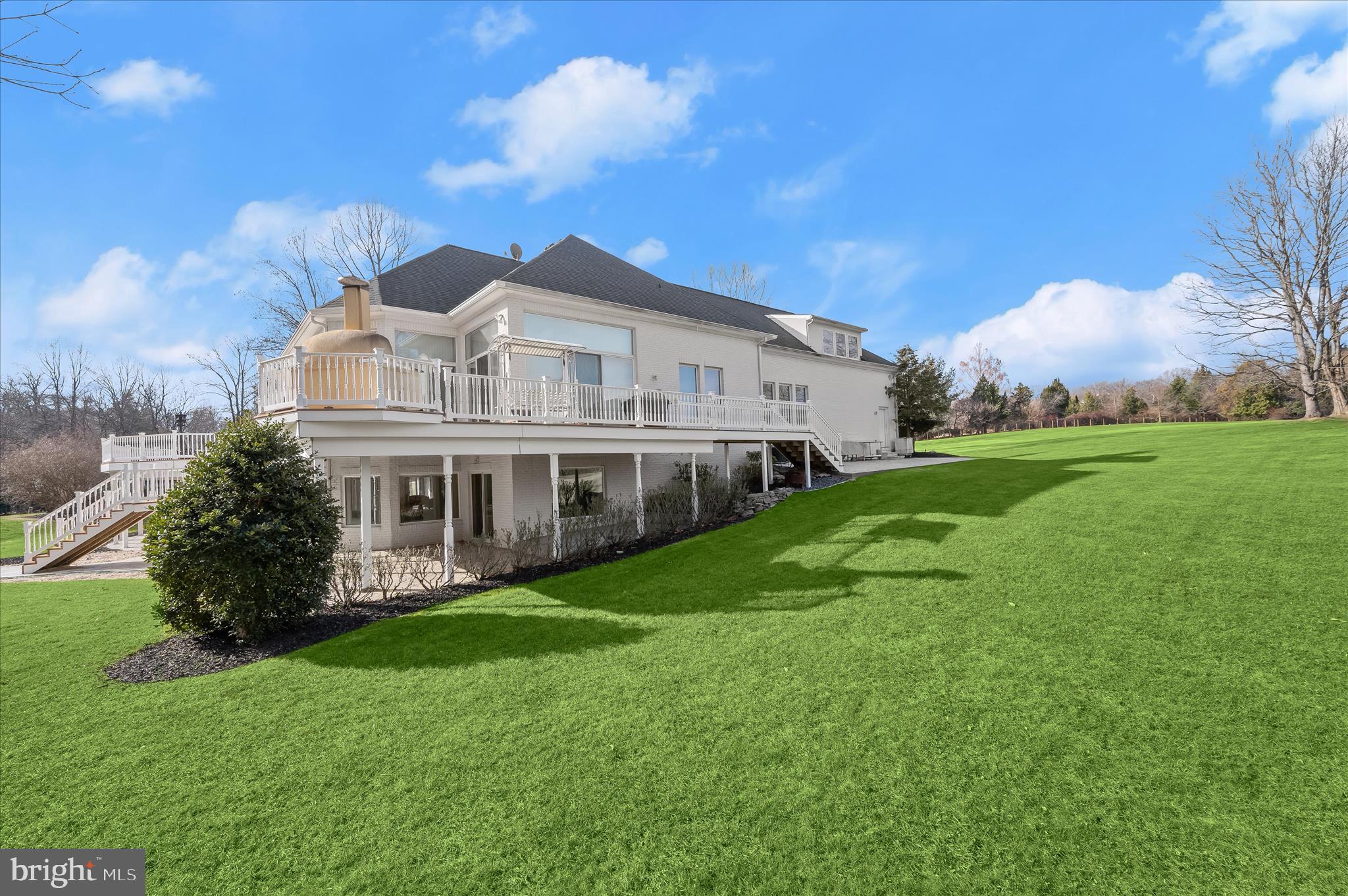 11678 Frederick Road Ellicott City, MD 21042 - Photo 109 of 118 a view of a house with a big yard potted plants and large tree