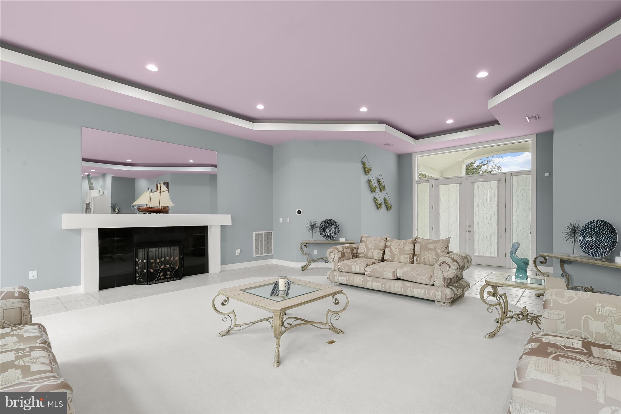 11678 Frederick Road Ellicott City, MD 21042 - Photo 15 of 118 a living room with furniture a fireplace and a table