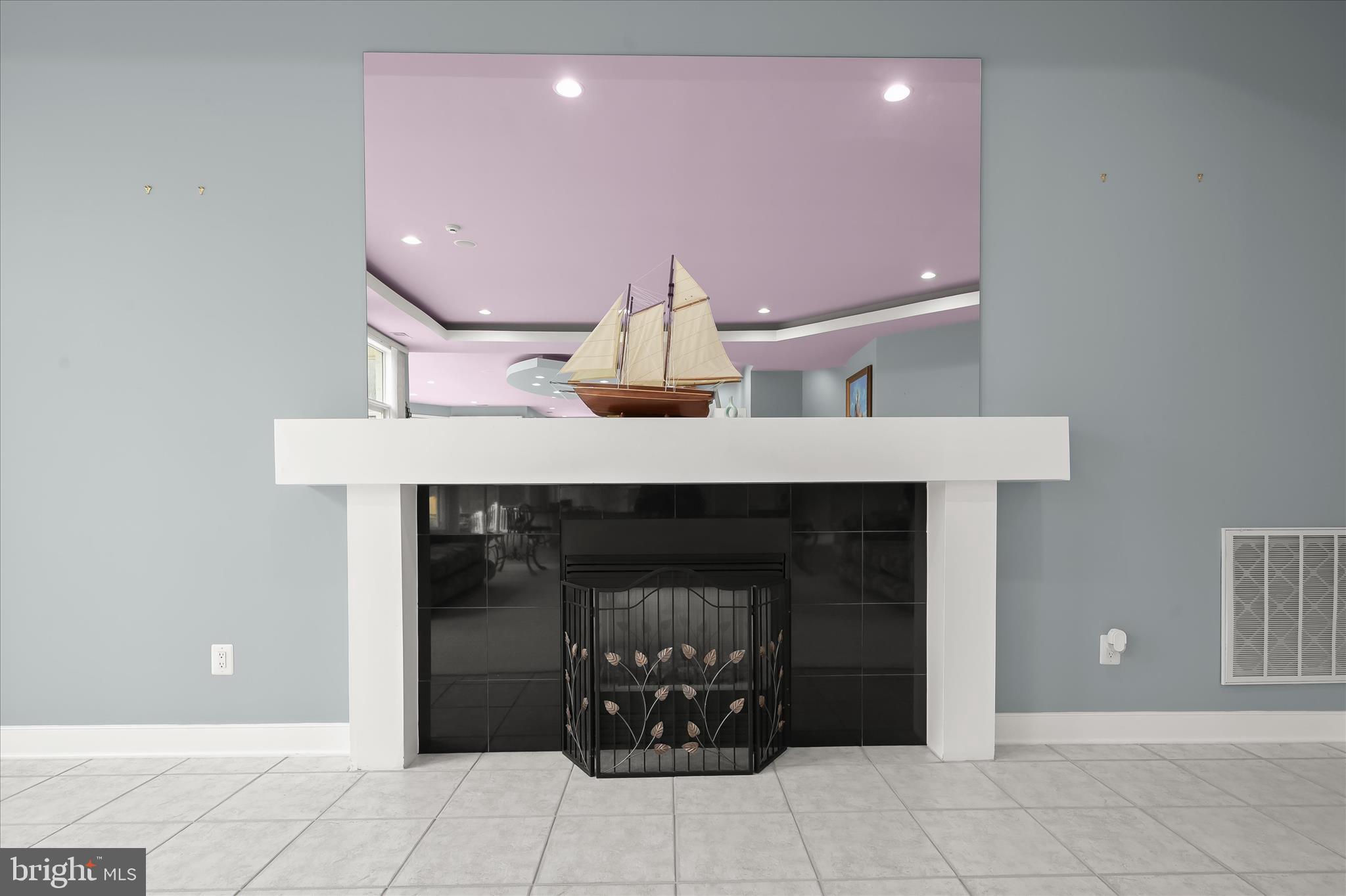 11678 Frederick Road Ellicott City, MD 21042 - Photo 20 of 118 a living room with furniture and a fireplace