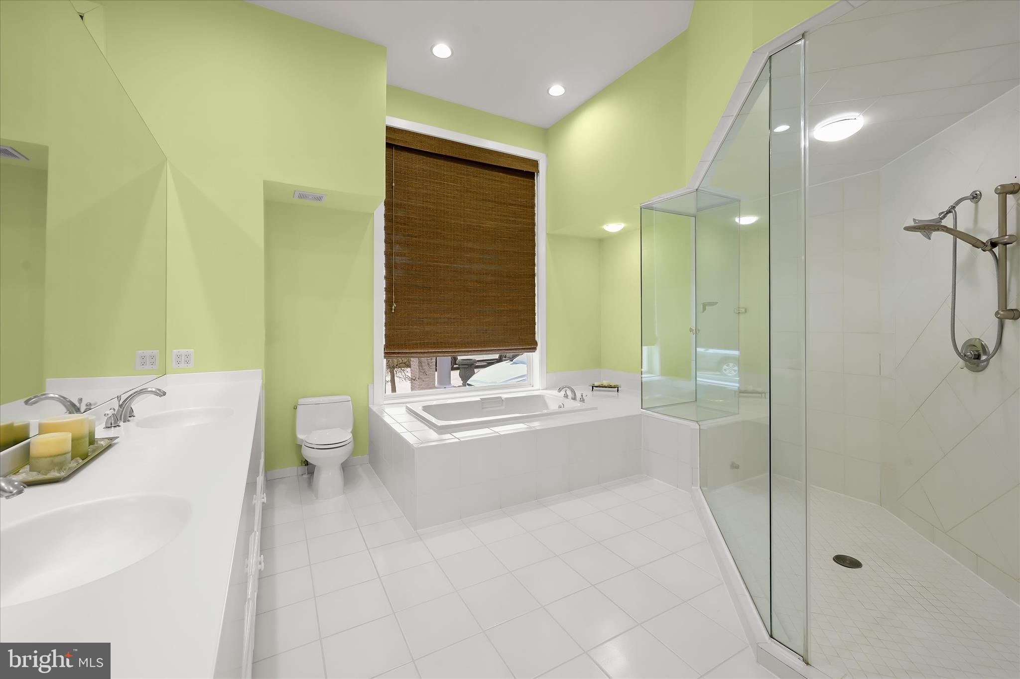 11678 Frederick Road Ellicott City, MD 21042 - Photo 30 of 118 a bathroom with a tub sink mirror and toilet