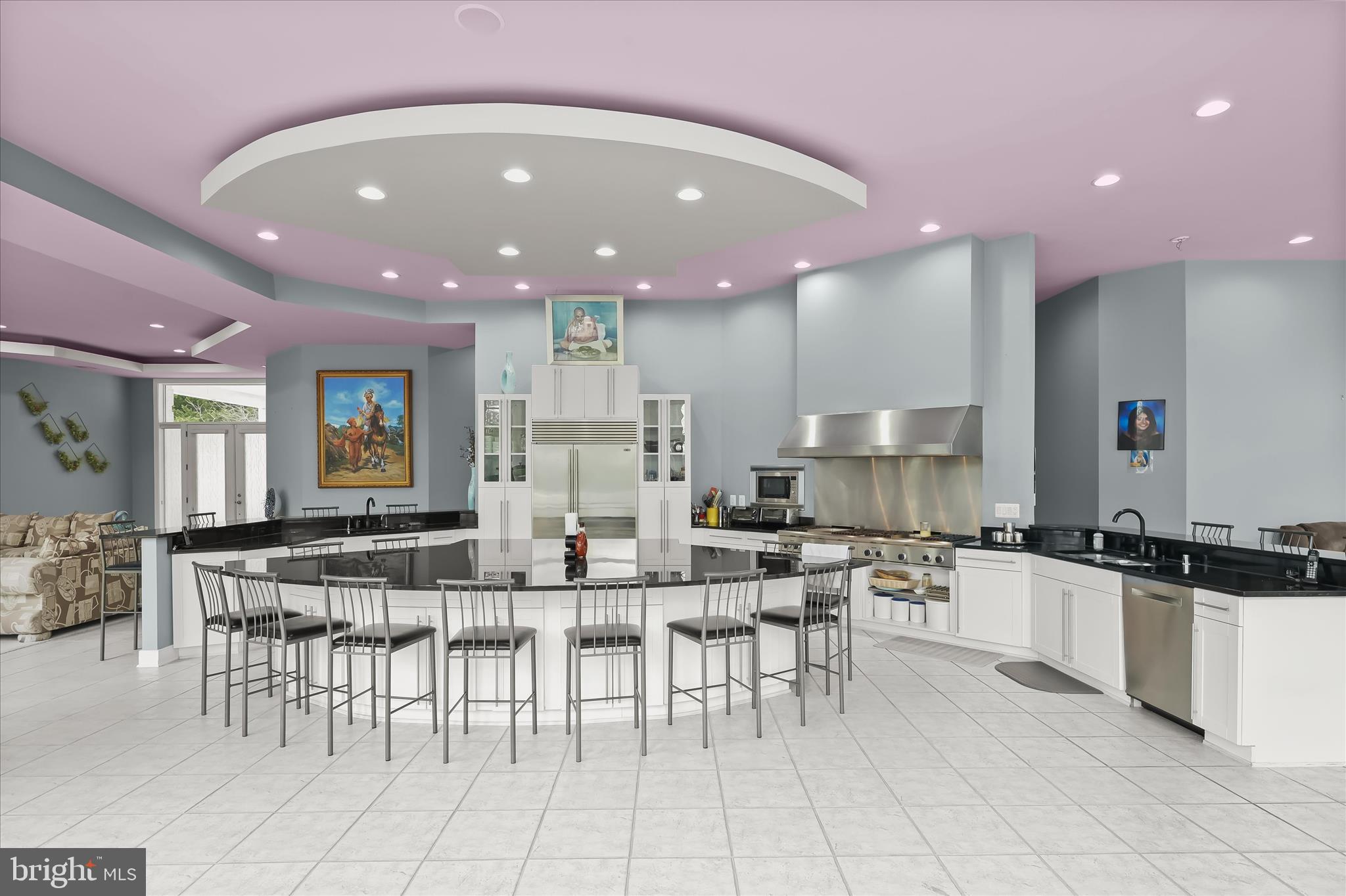 11678 Frederick Road Ellicott City, MD 21042 - Photo 41 of 118 a kitchen with stainless steel appliances a sink a stove a table and chairs