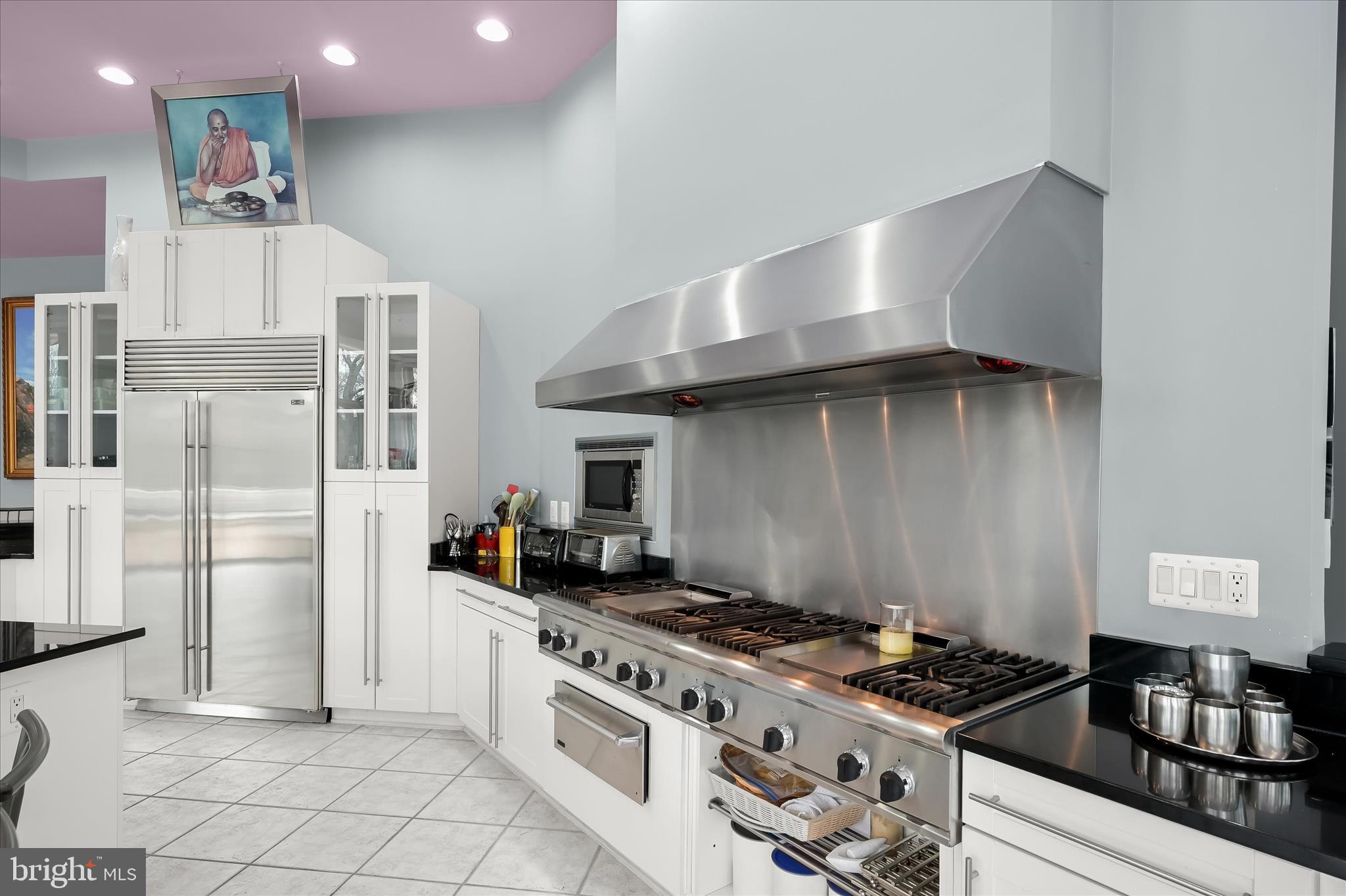 11678 Frederick Road Ellicott City, MD 21042 - Photo 46 of 118 a kitchen with stainless steel appliances granite countertop a stove and a refrigerator