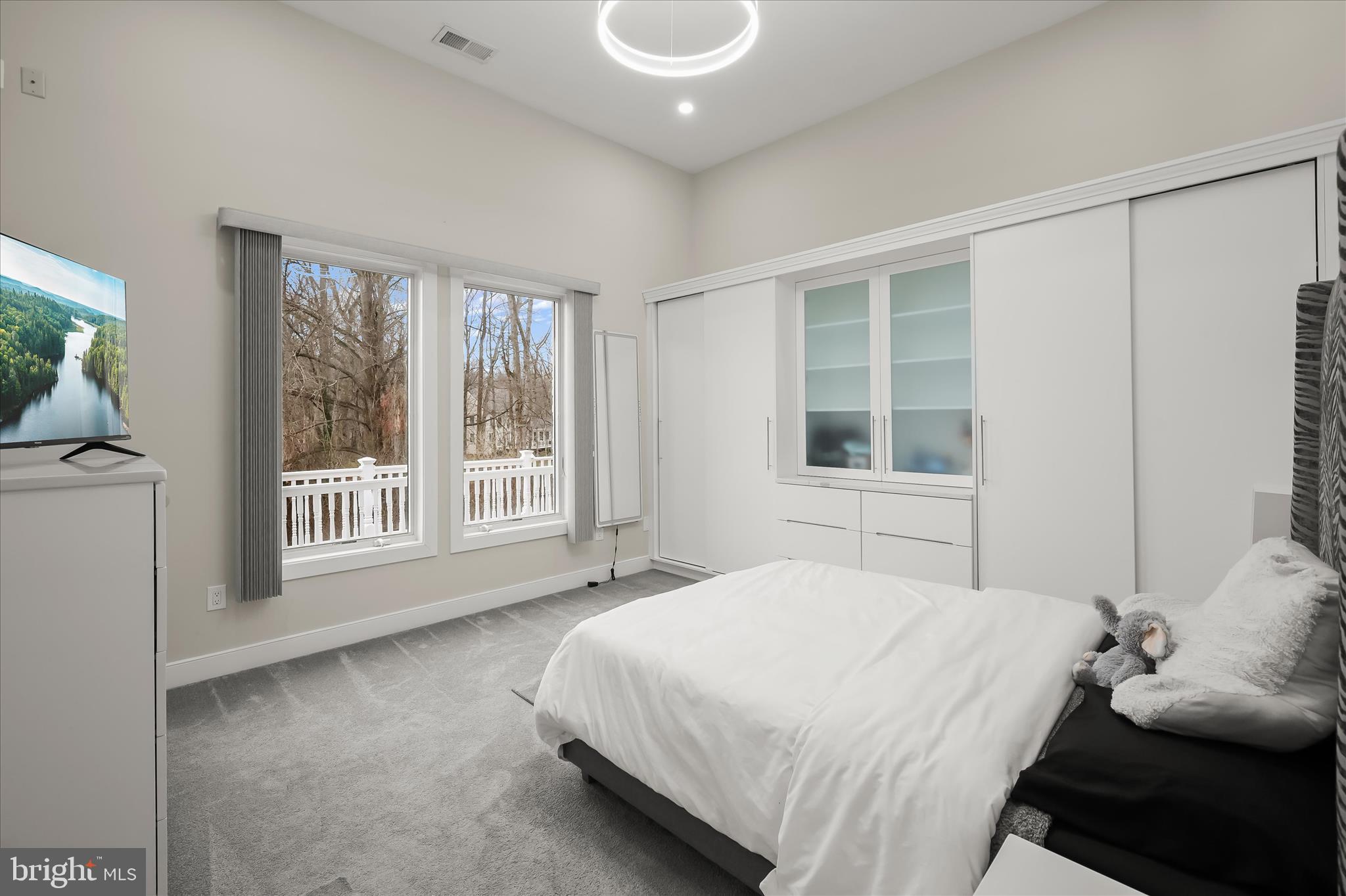 11678 Frederick Road Ellicott City, MD 21042 - Photo 53 of 118 a bedroom with a bed and a large window